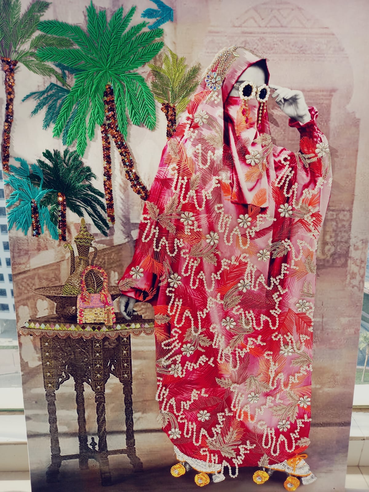 Detail of the commissioned Azaïdé artwork — embroidered palms, beadwork and pearl-stitched Chanel motif