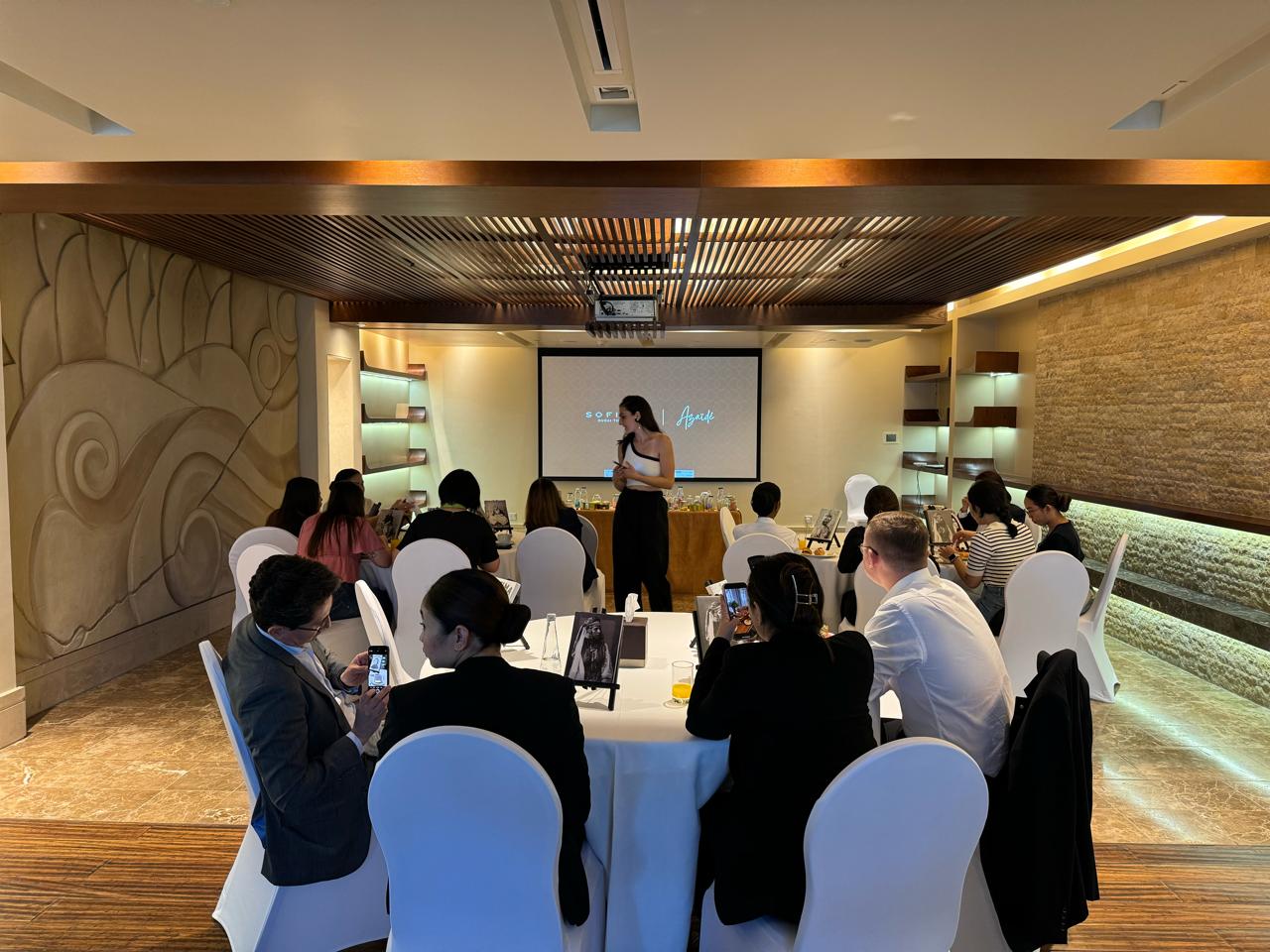 Azaïdé presenting her work to guests in the Sofitel Dubai The Palm salon